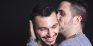 Couple of men kissing