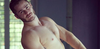 Austin Armacost naked on a chair
